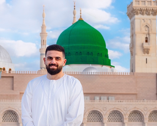 Arabian man in front of mosque